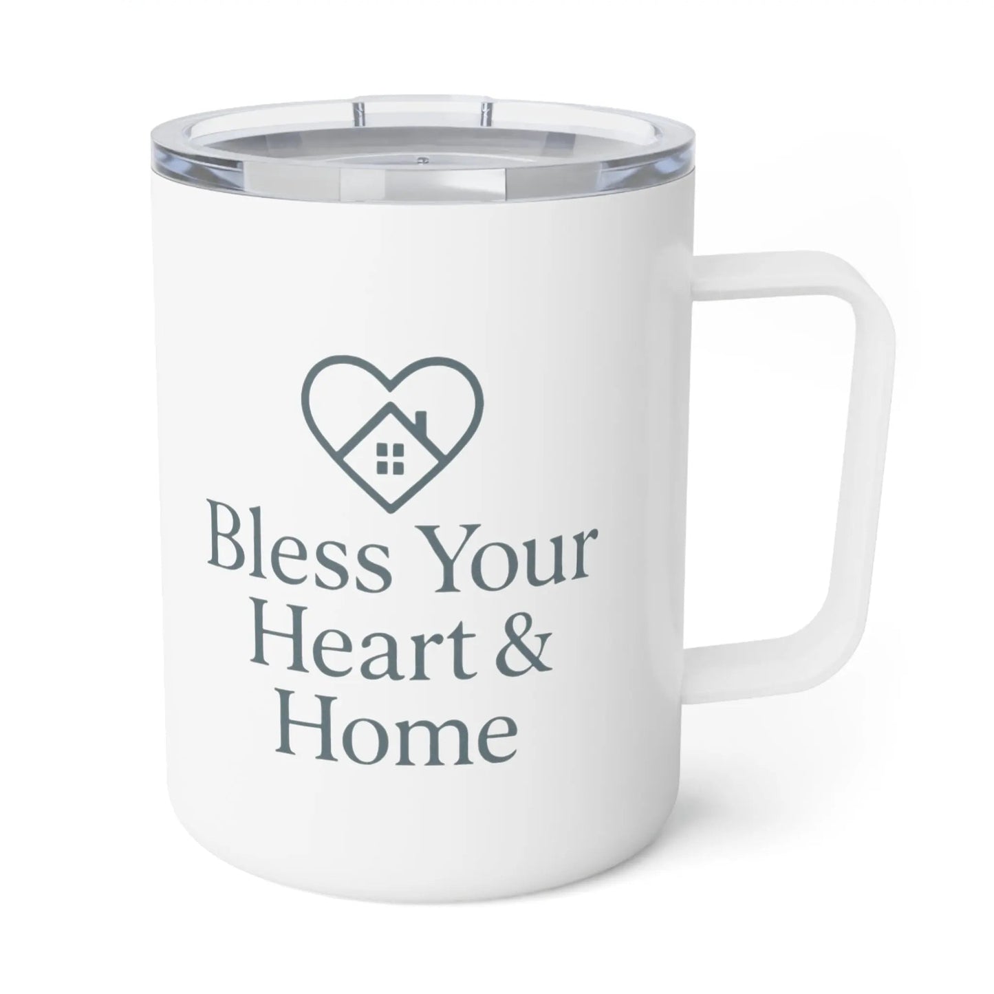 A white insulated travel mug with a clear lid, featuring a dark gray printed heart-shaped house icon and the text 'Bless Your Heart & Home' on the front. A small 'Comfort Colors' logo is visible in the top-left corner.