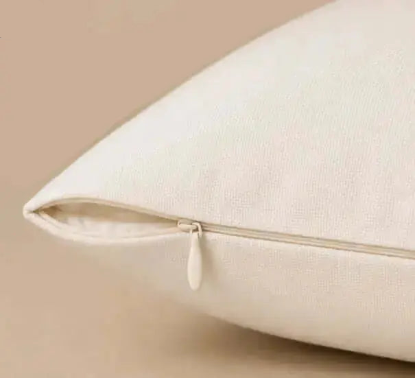 Close-up of a beige pillow on a beige background