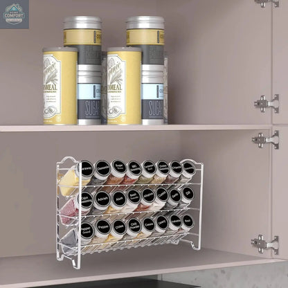 3-tier metal spice rack organizer with glass jars placed inside kitchen cabinet for space-saving storage