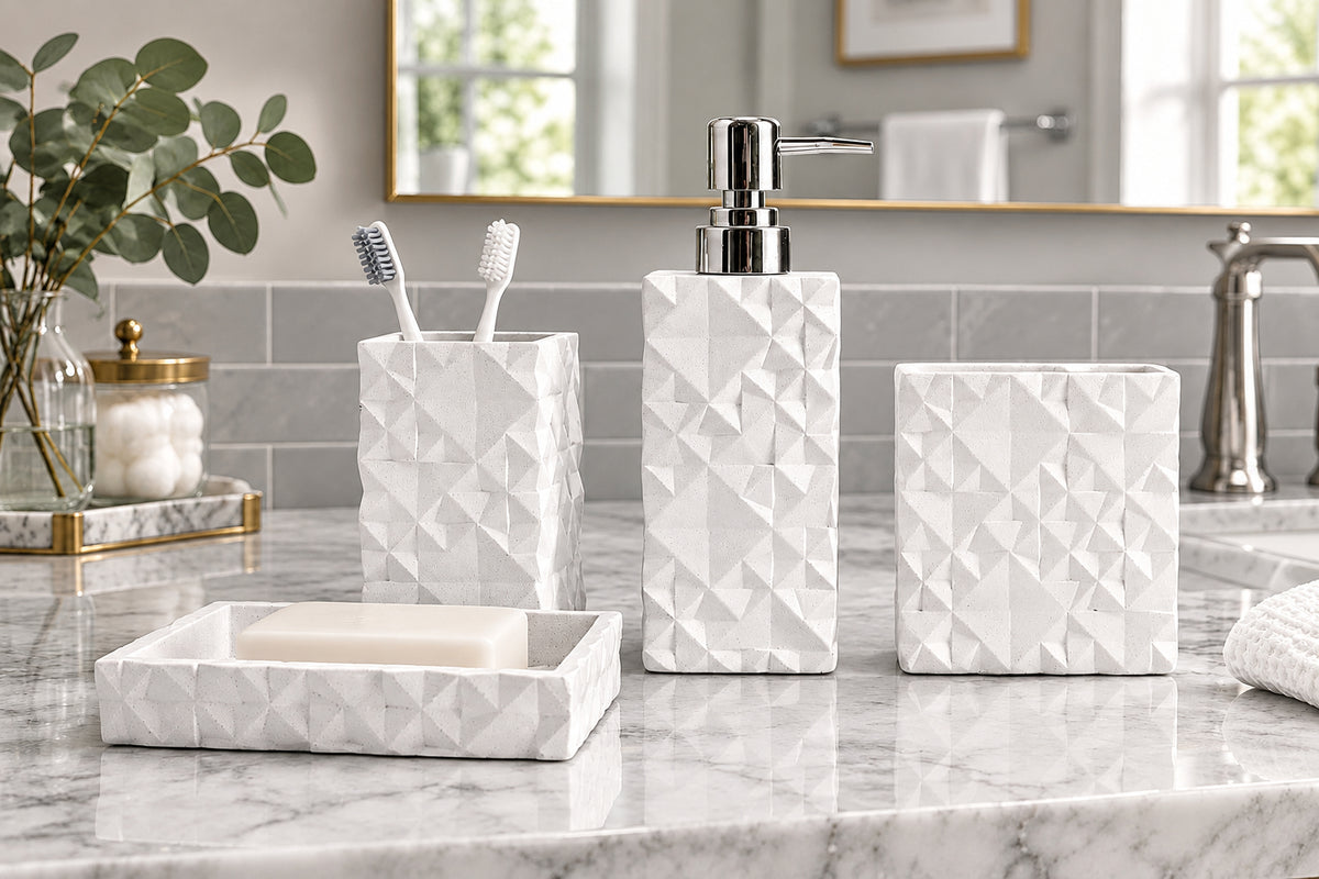White geometric textured bathroom accessories set with soap dispenser, toothbrush holder, tumbler, and soap dish on countertop