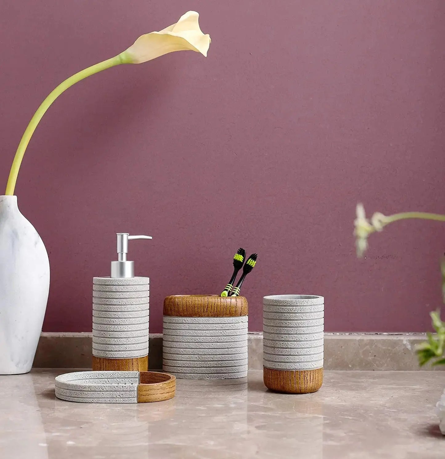 Gray and wood bathroom accessories set with soap dispenser, toothbrush holder, tumbler, and soap dish on bathroom counter