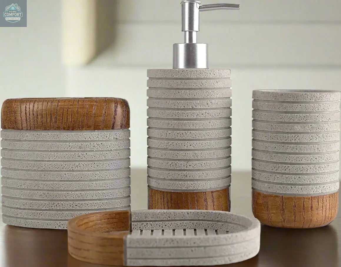 Close up view of gray and wood bathroom accessories set including soap dispenser, tumbler, toothbrush holder, and soap dish