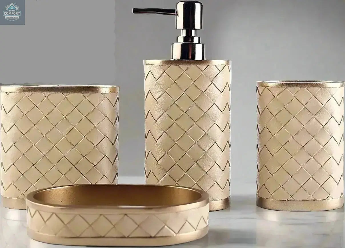 Gold woven bathroom accessories set with soap dispenser, toothbrush holder, tumbler, and soap dish on countertop