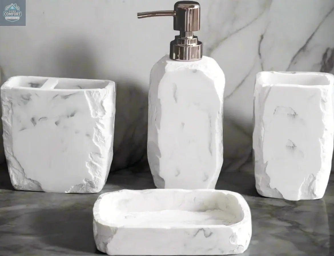 White marble textured bathroom accessories set with soap dispenser, toothbrush holder, tumbler, and soap dish on counter