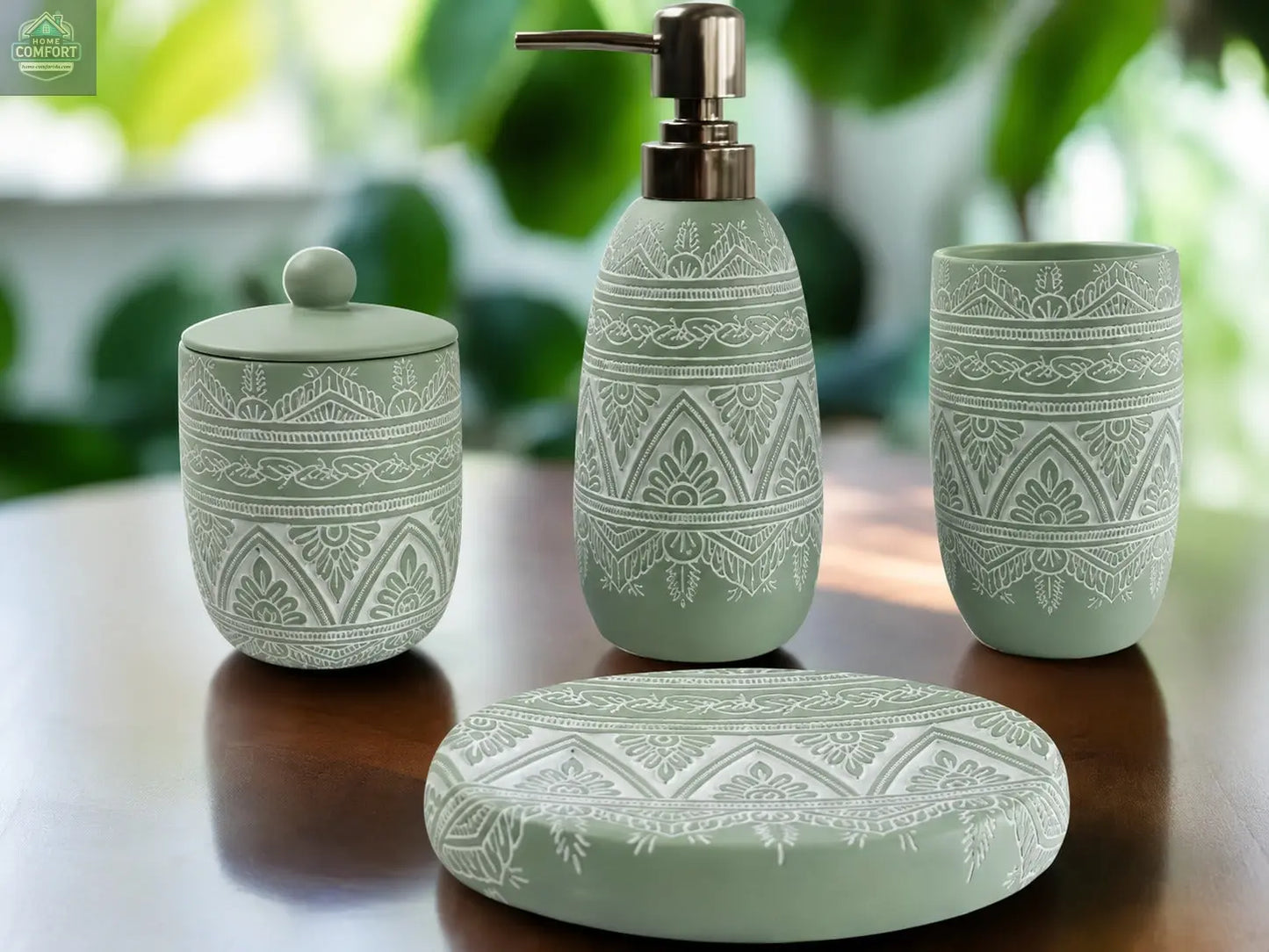 Green patterned bathroom accessories set with soap dispenser, toothbrush holder, tumbler, and soap dish on countertop