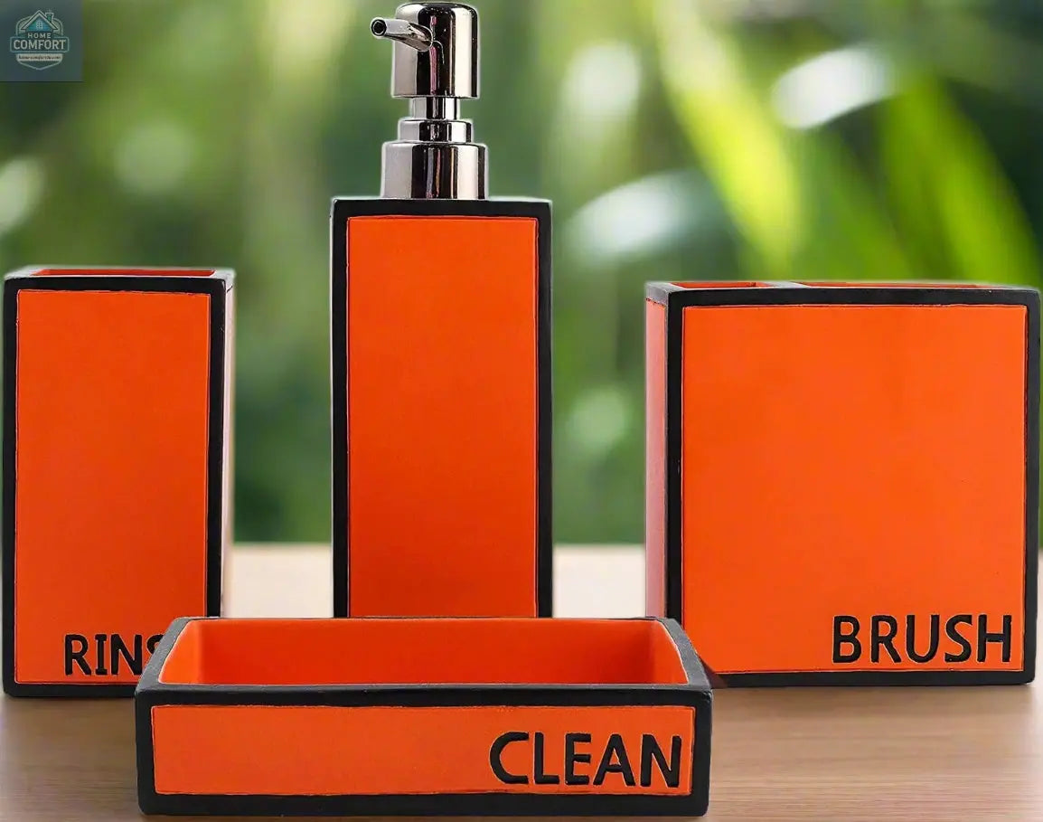 Orange modern bathroom accessories set with soap dispenser, toothbrush holder, tumbler, and soap dish labeled rinse brush and clean