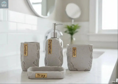 Gray stone bathroom accessories set with soap dispenser, toothbrush holder, tumbler, and tray with labeled pieces on countertop