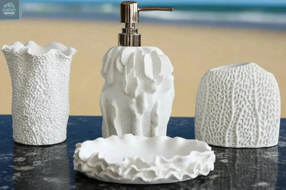 White textured bathroom accessories set with soap dispenser, toothbrush holder, tumbler, and soap dish with coral style surface
