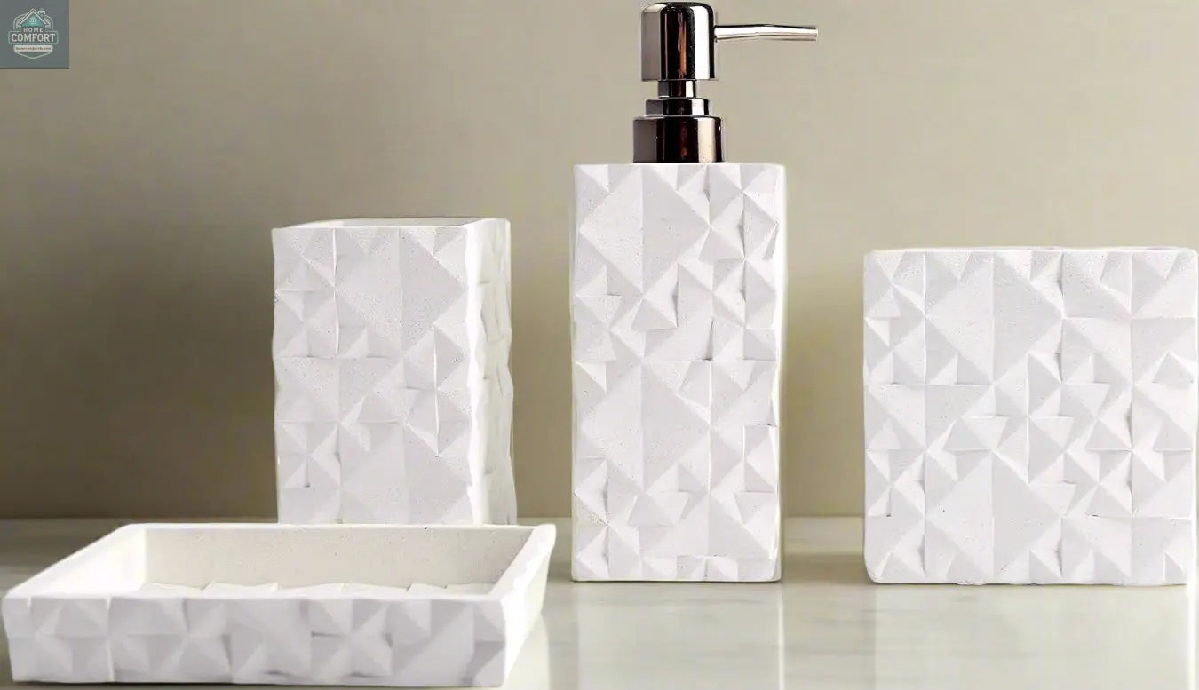 White geometric textured bathroom accessories set with soap dispenser, toothbrush holder, tumbler, and soap dish on countertop