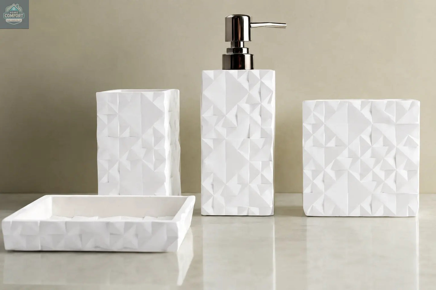 White geometric textured bathroom accessories set with soap dispenser, toothbrush holder, tumbler, and soap dish on countertop