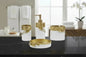 White and gold bathroom accessories set with leaf detail including soap dispenser, toothbrush holder, tumbler, and soap dish