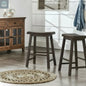 Set of two dark brown wood backless counter stools placed in farmhouse style room