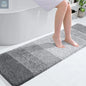 Light grey extra soft microfiber bath mat with non slip backing and absorbent surface 59x17 inch