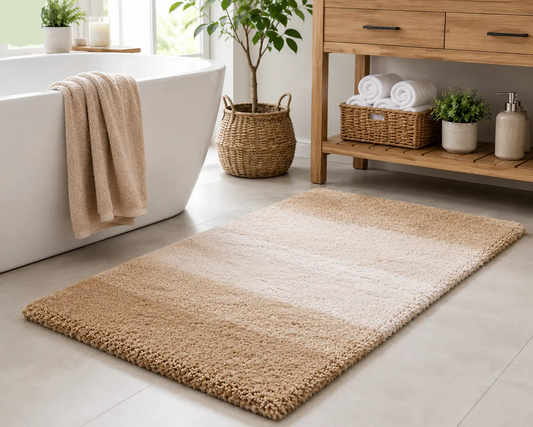 Bathroom with a bath mat, bathtub, and wooden shelf.