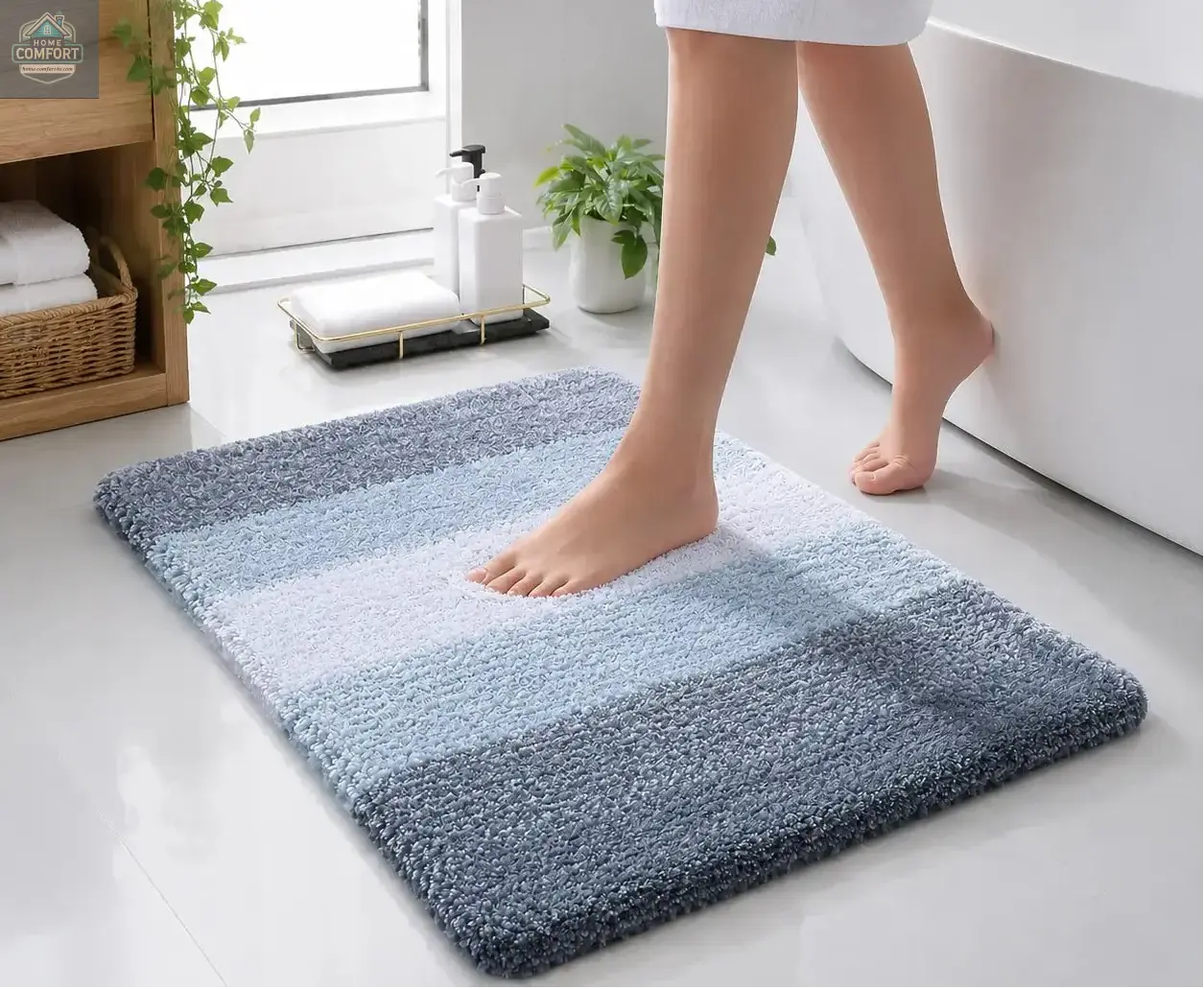 Person stepping onto a gradient bath mat in a bathroom setting.