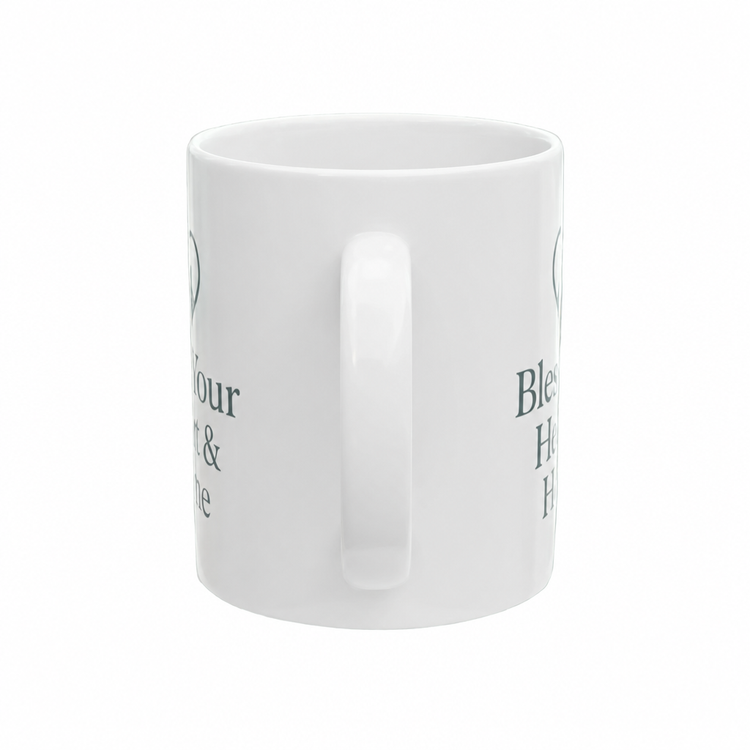 A white ceramic mug with a side handle, featuring partial dark green printed text on the side, shown against a plain white background.