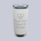A white insulated tumbler with a clear lid and silver metal trim, featuring the text 'Bless Your Heart & Home' and a heart-shaped house graphic on the front. A small 'Comfort Colors' logo is visible in the top-left corner.