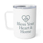 A white insulated travel mug with a clear lid, featuring a dark gray printed heart-with-house icon and the text 'Bless Your Heart & Home' on the front.