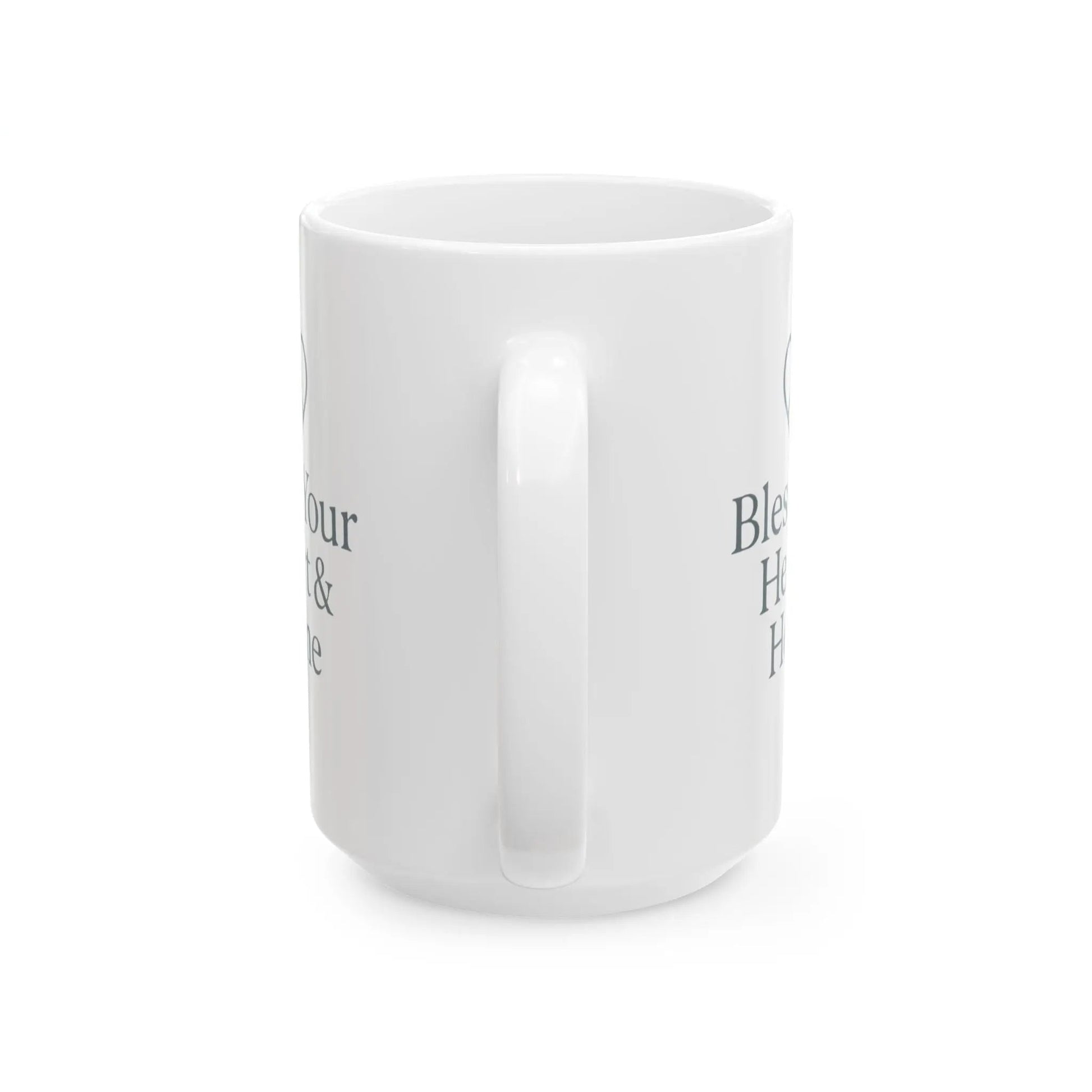 A white ceramic mug with a handle, shown from a side angle on a white background. The mug features dark gray printed text partially visible on both sides.