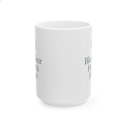 A white ceramic mug with dark gray printed text partially visible on the side, shown against a plain white background.