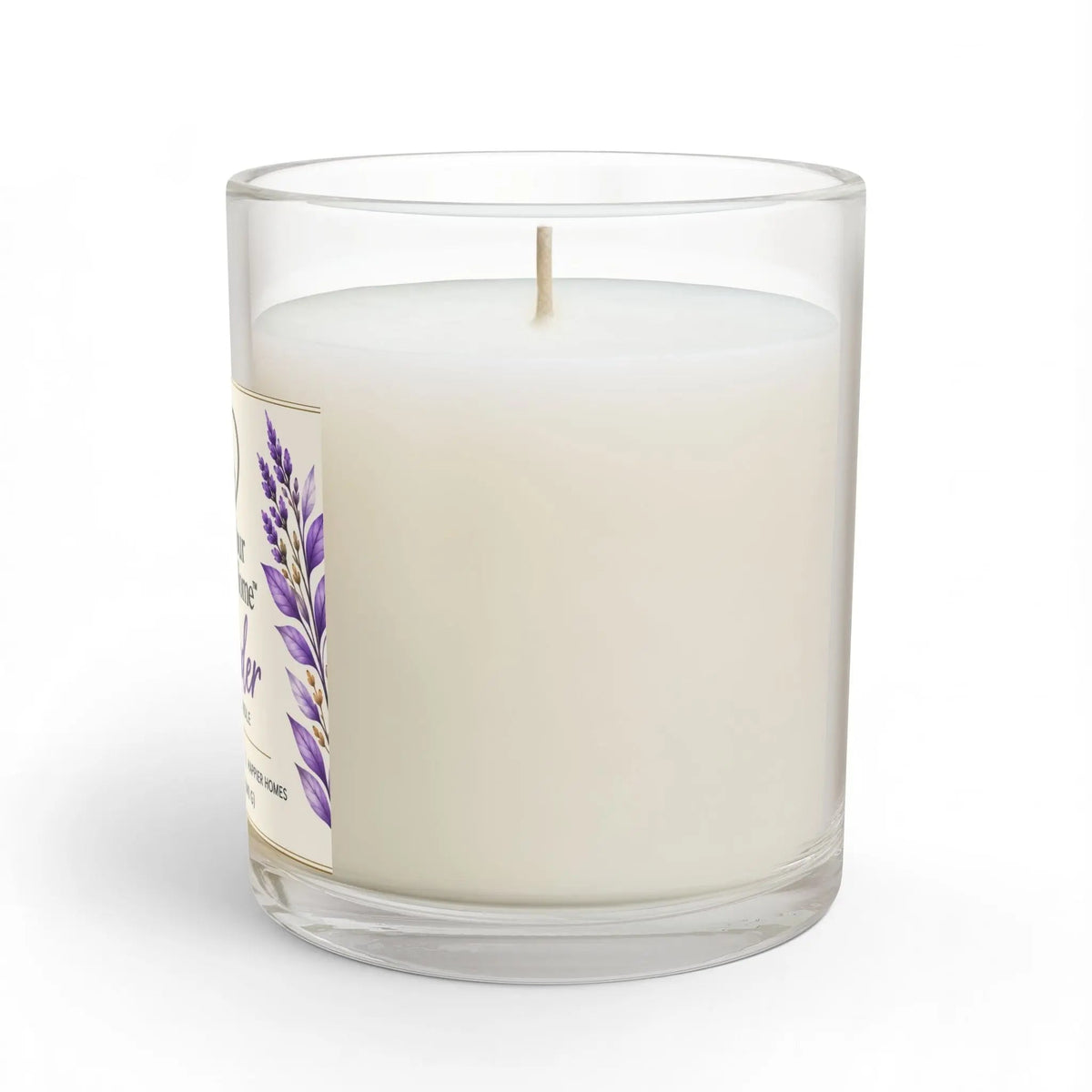 A white wax candle in a clear glass jar with a single wick, featuring a lavender floral label on the side, set against a plain white background.