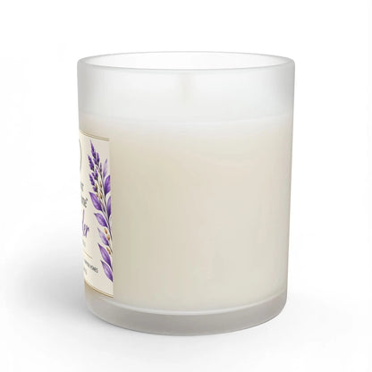 A frosted glass jar candle with off-white wax and a decorative label featuring purple lavender flowers, shown on a clean white background.