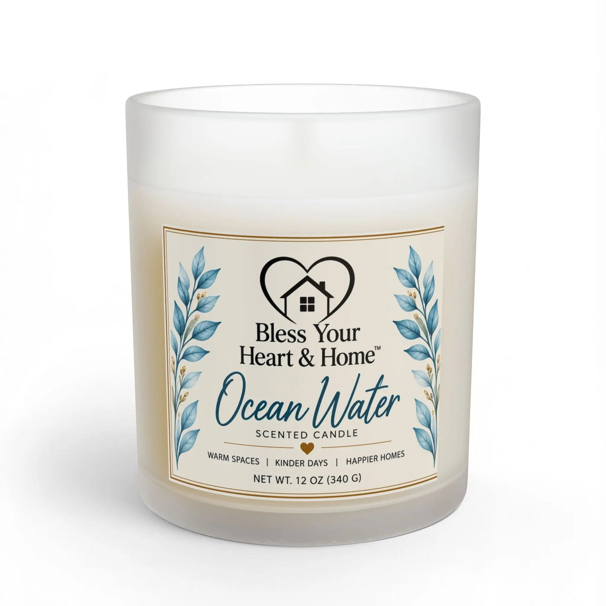 A frosted glass jar candle with a cream-colored wax and a decorative front label reading 'Ocean Water Scented Candle' by Bless Your Heart & Home, shown on a white background.