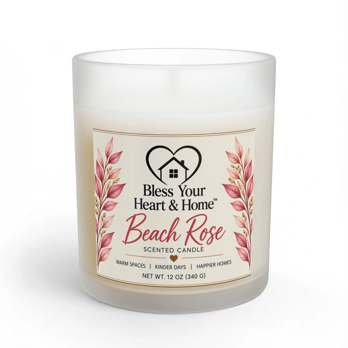 A 11 oz scented candle in a frosted glass jar with a cream-colored wax and a decorative label that reads 'Bless Your Heart & Home Beach Rose'. The label features pink rose illustrations and gold accents, set against a clean white background.