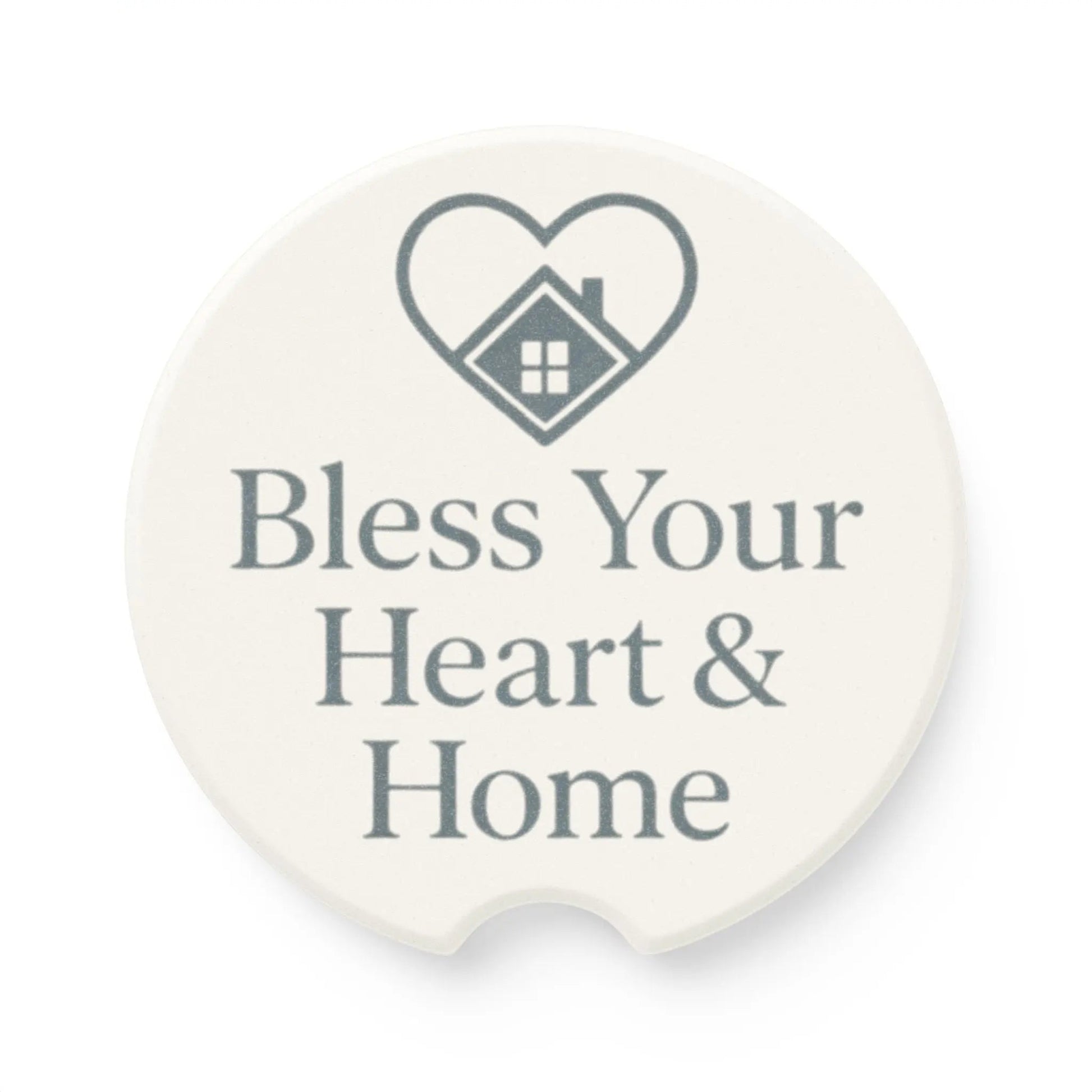 A round white coaster with a gray printed heart and house graphic above the words 'Bless Your Heart & Home'.