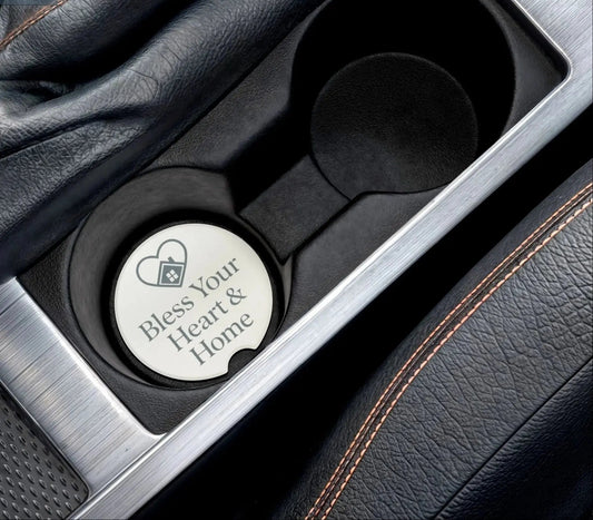 Car cup holder with a branded coaster inside