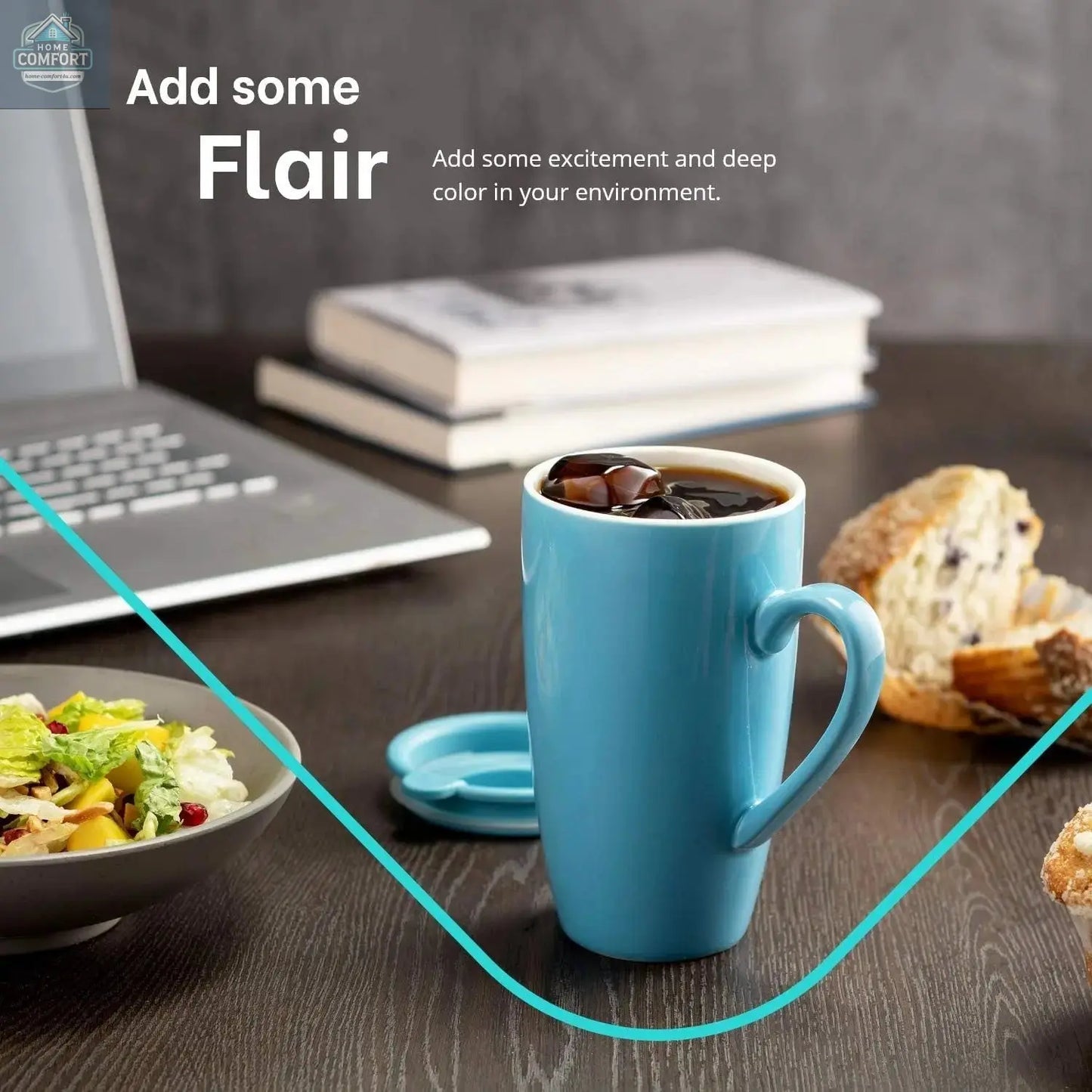 single ceramic coffee mug with lid filled with iced coffee on desk near laptop and food