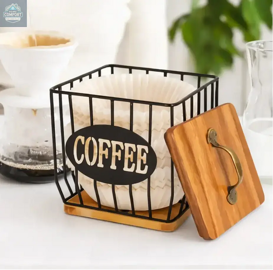 Coffee filter holder and capsule basket with wood lid displayed on coffee bar beside pour over coffee maker