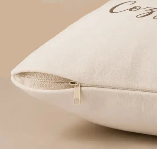 Cozy Nights Square Throw Pillow  with 'Cozy' text on a beige background