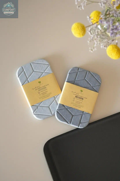 Geometric diatomite soap dish with quick-dry stone material shown packaged on bathroom counter