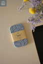 Geometric quick-dry diatomite soap dish displayed with kraft packaging on countertop