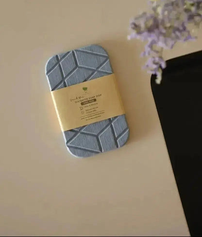 Geometric quick-dry diatomite soap dish displayed with kraft packaging on countertop