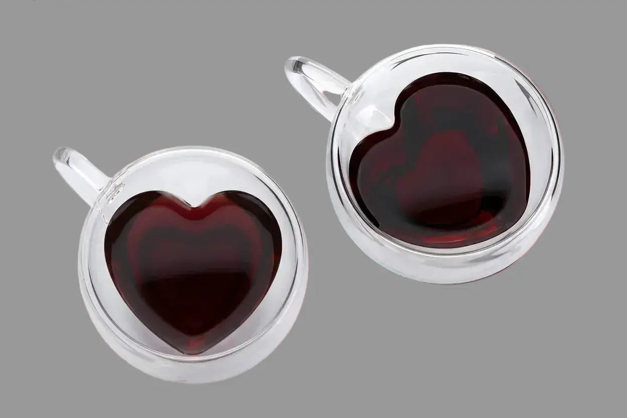 Top view of double wall heart-shaped glass mugs filled with coffee showing insulated borosilicate glass design
