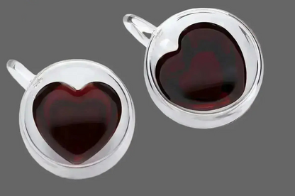 Top view of double wall heart-shaped glass mugs filled with coffee showing insulated borosilicate glass design
