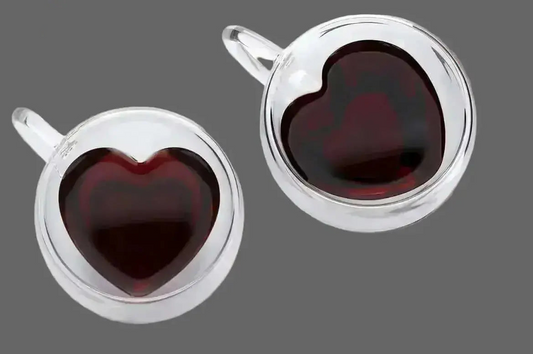 Top view of double wall heart-shaped glass mugs filled with coffee showing insulated borosilicate glass design
