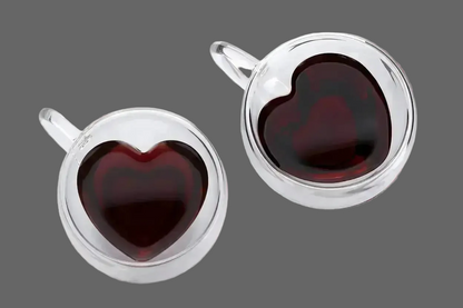 Top view of double wall heart-shaped glass mugs filled with coffee showing insulated borosilicate glass design

