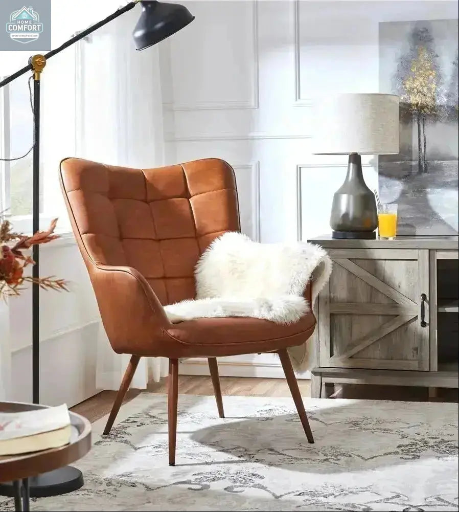 Brown faux leather wingback accent chair placed in a living room beside a floor lamp and cabinet