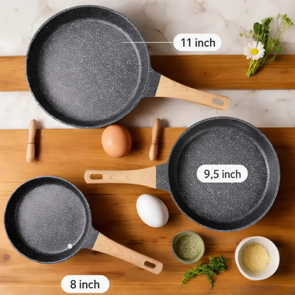 Flat lay showing three sizes of nonstick frying pans including 8 inch 9.5 inch and 11 inch cookware