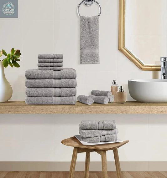 Chateau Home 16 piece cotton bath towel set in light grey stacked in bathroom setting