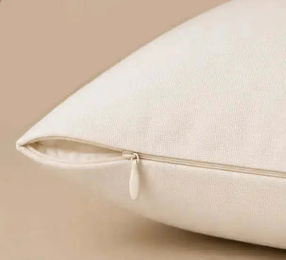 Close-up of a beige pillow on a beige background