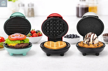 Three mini waffle makers open on a kitchen counter showing burger, waffle, and dessert cooking examples.