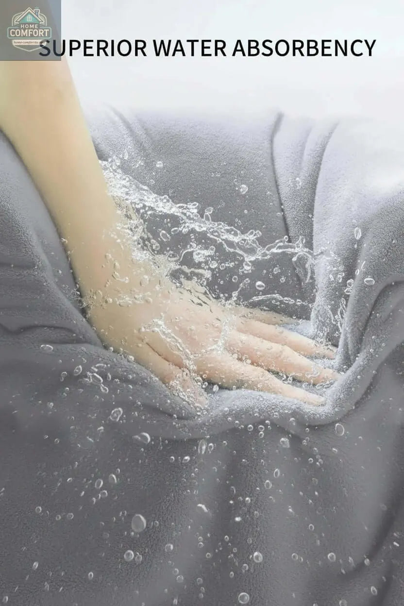Oversized Bath Towel set Hand touching gray fabric with water droplets, emphasizing superior water absorbency.
