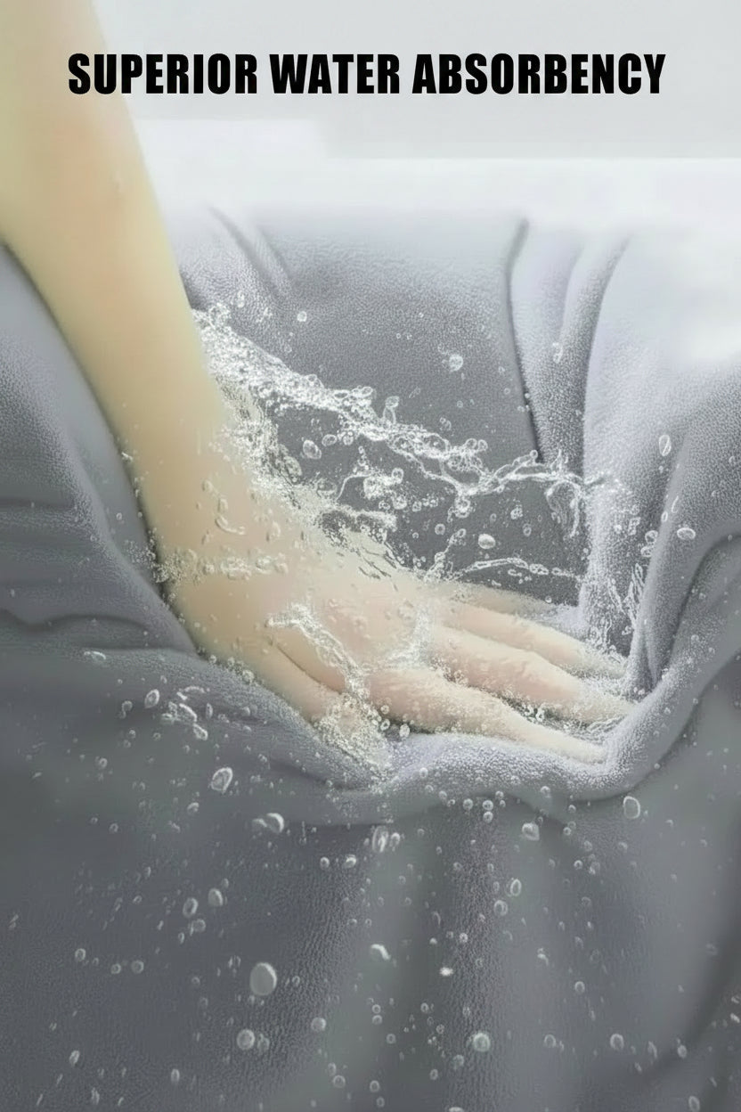 Oversized Bath Towel set Hand touching gray fabric with water droplets, emphasizing superior water absorbency.