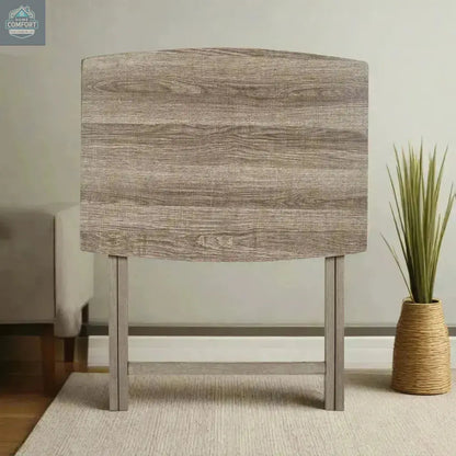 Rustic XL folding tray table folded upright against wall