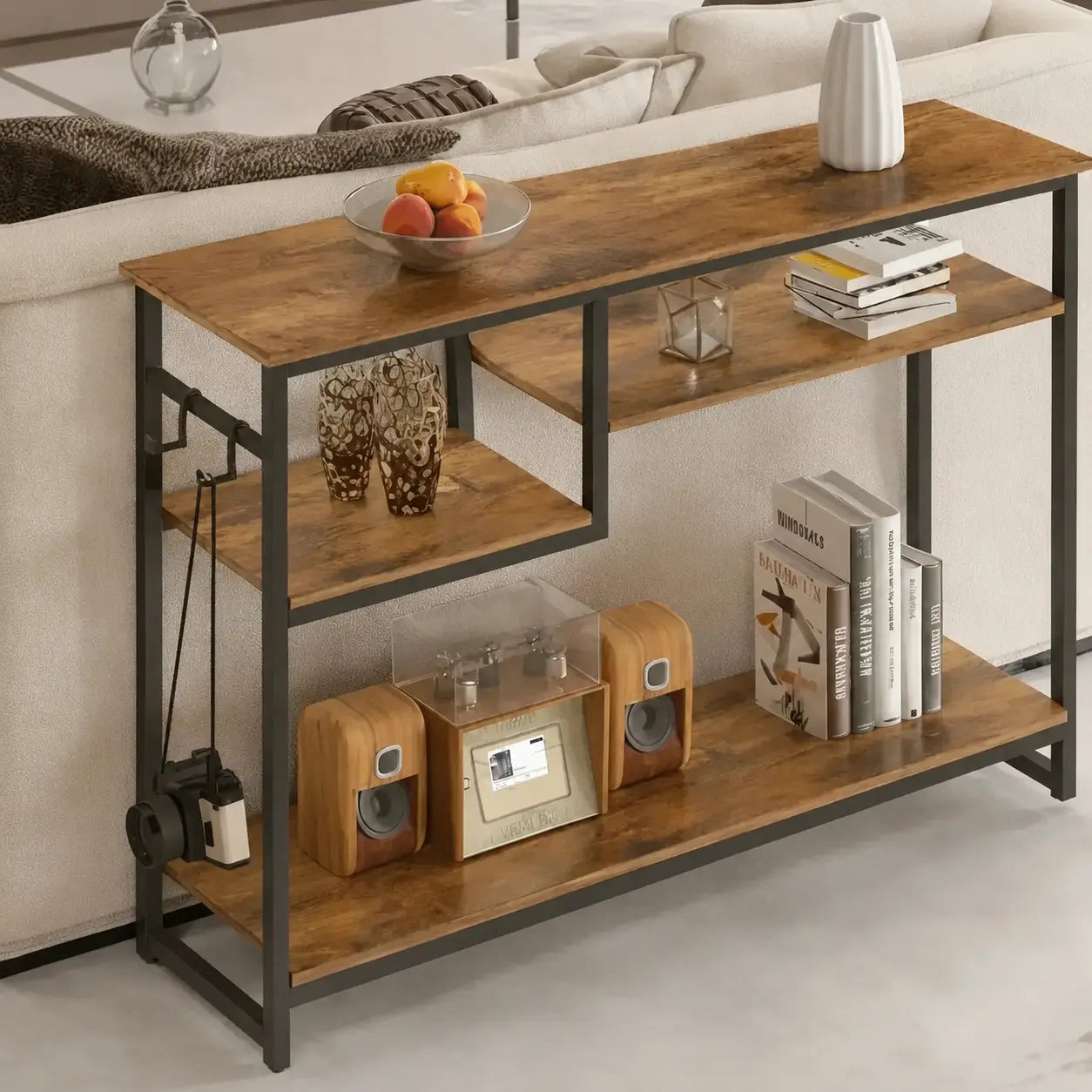 Rustic wood and metal entryway console table placed behind sofa in living room
