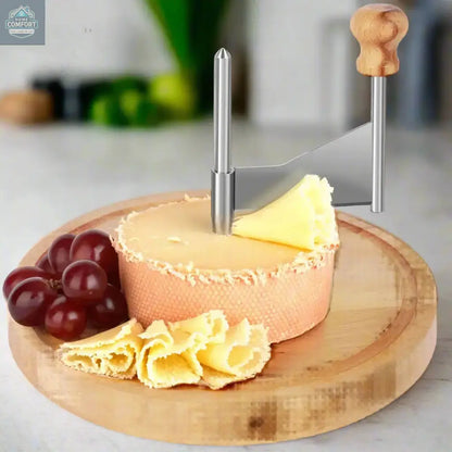 Handheld stainless steel cheese curler with beechwood base creating cheese curls on a serving board
